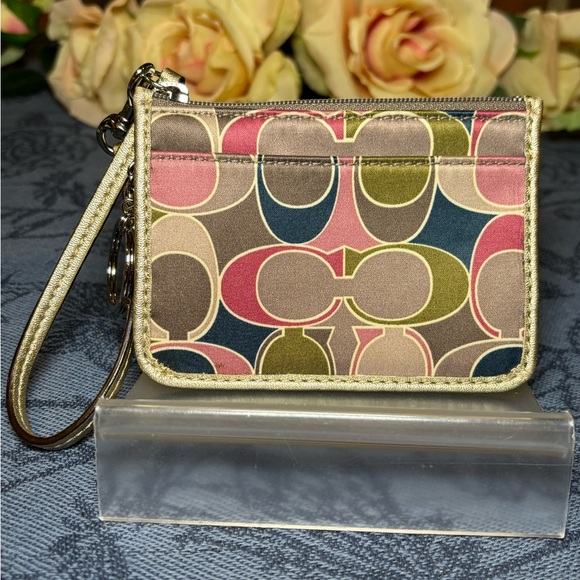 Coach Handbags - Coach Multi color signature Ashley with gold leather on one side. card w…